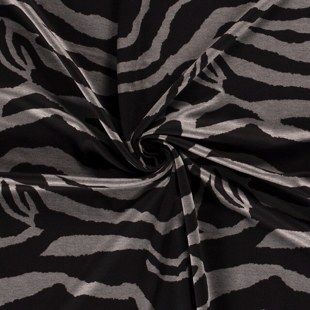 Jersey fabric discharge printed animals brown